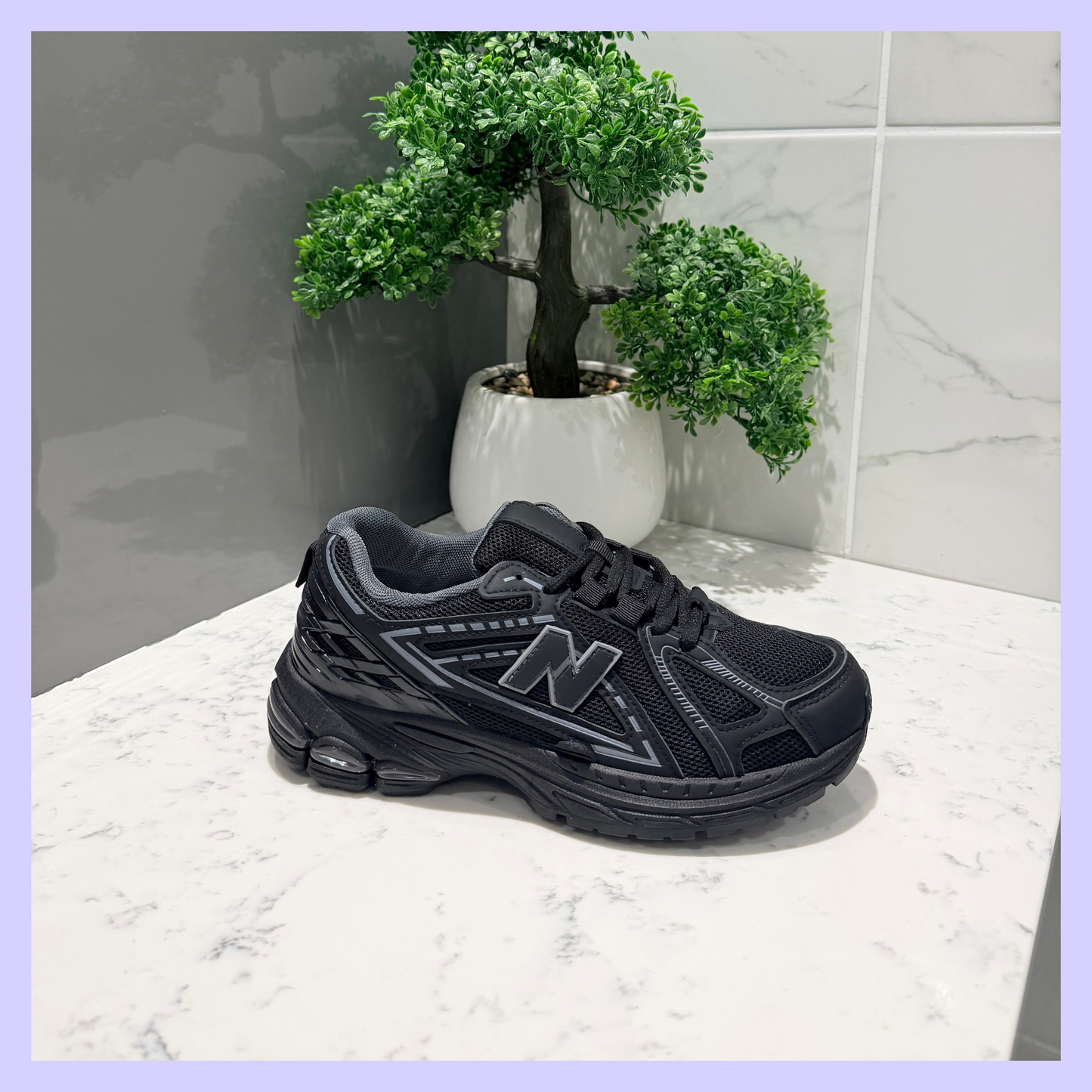 NANCY BLACK TRAINER